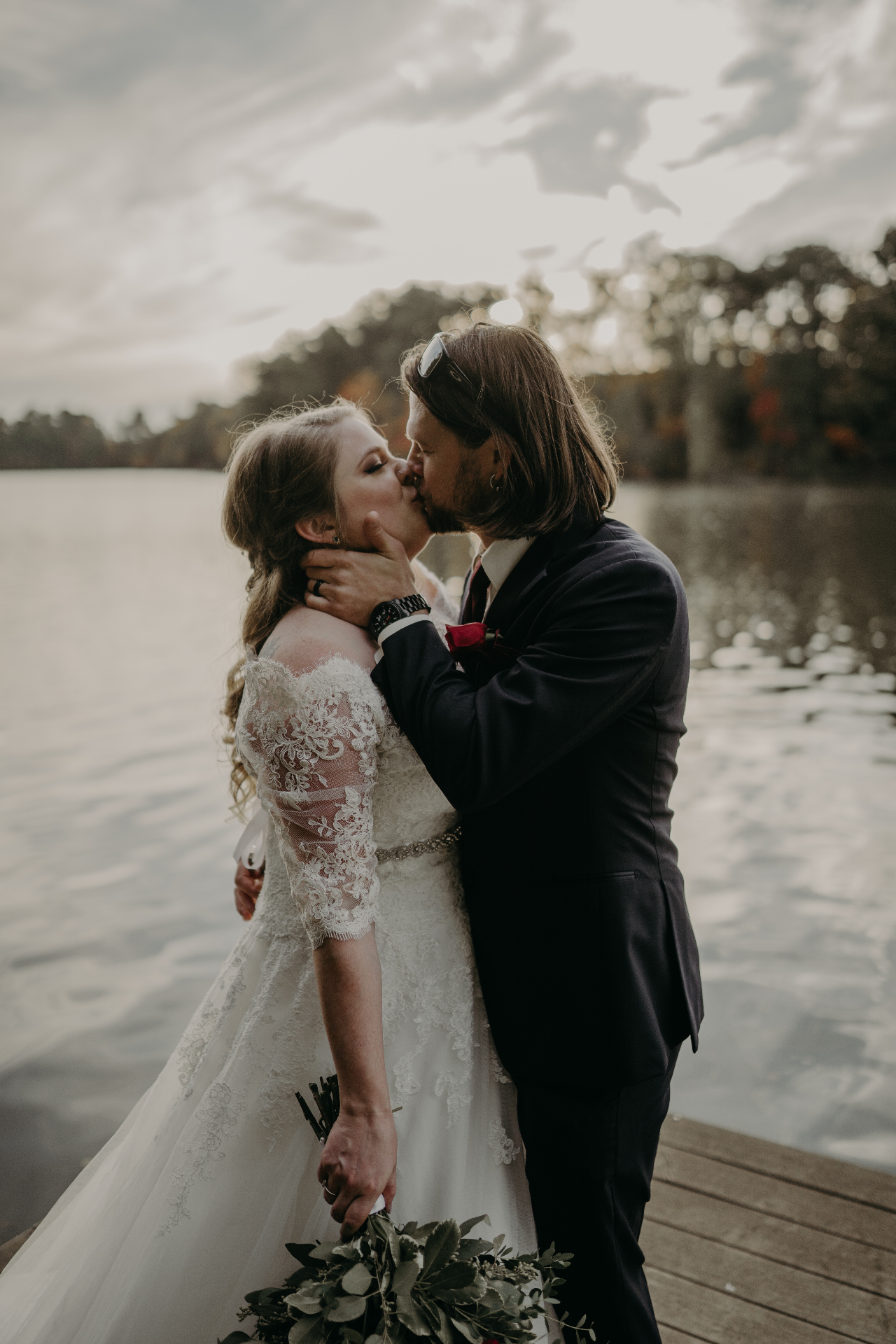 Couple sharing a kiss by the lake